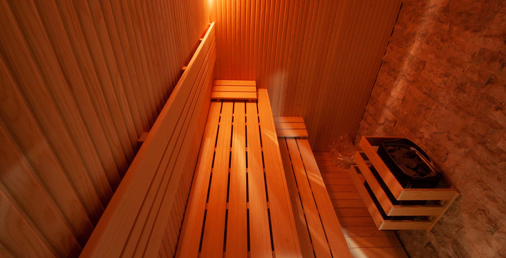 Upward perspective of a sauna in Amsterdam, capturing the elegant design, ambient lighting, and comfortable seating, creating a soothing and luxurious environment for relaxation.